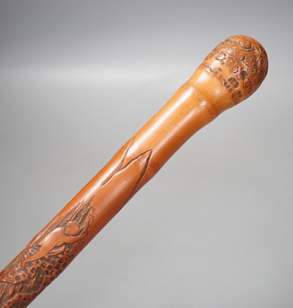 A Japanese carved bamboo walking stick, 89cm